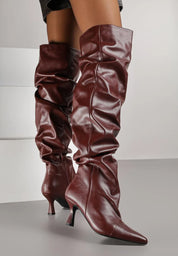 Burgundy high boots with a thin heel