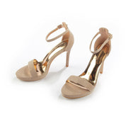 Gold sandals on a thin heel
