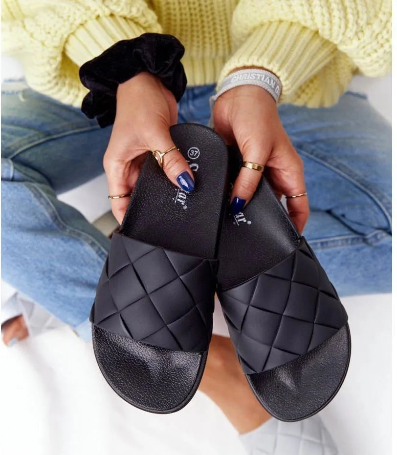 Black flat slippers