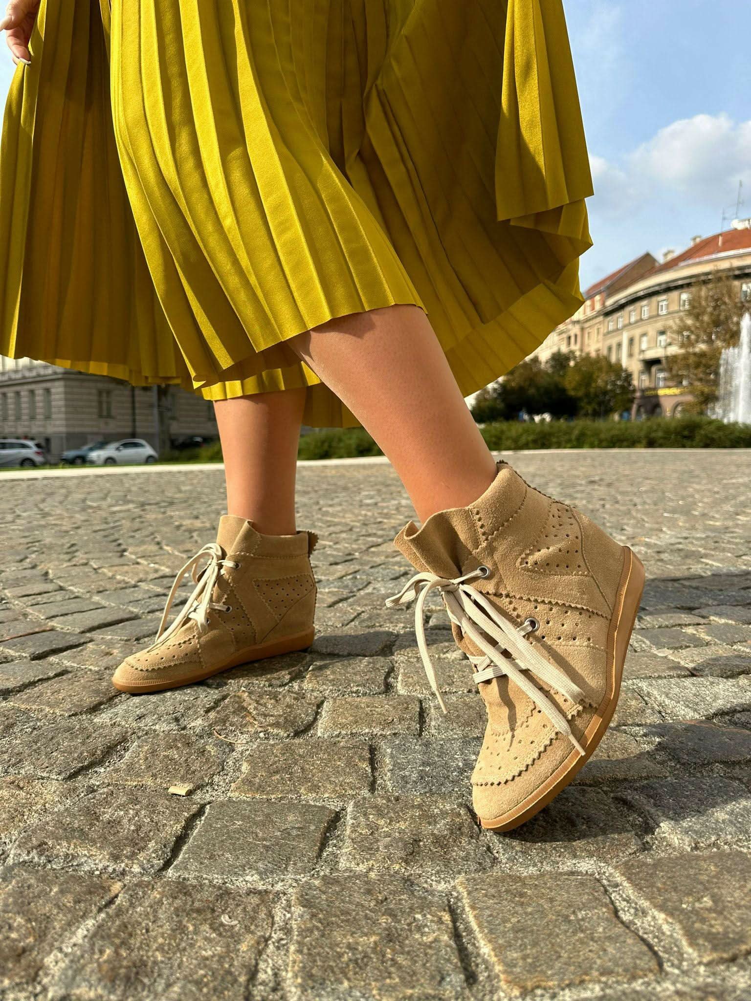 Red sneakers made of genuine leather