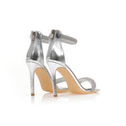 Silver sandals on a thin heel