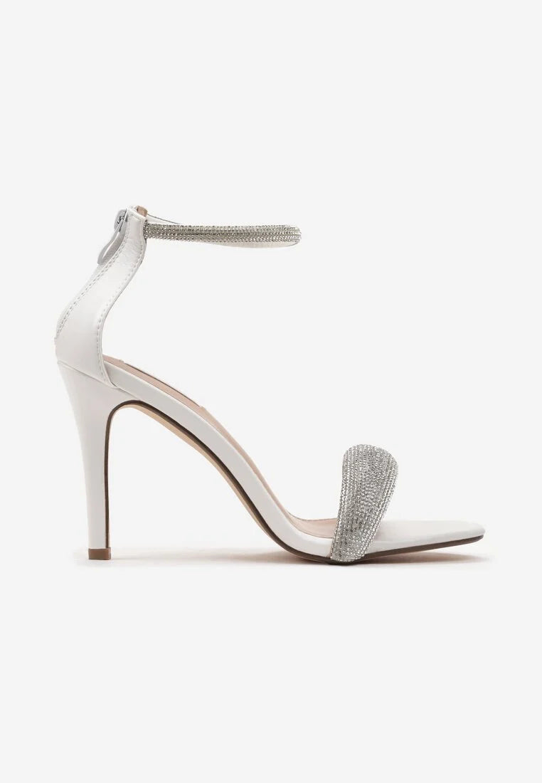 White sandals with a thin heel
