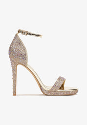 Gold sandals on a thin heel