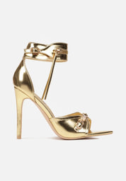 Gold sandals on a thin heel