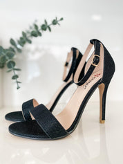 Black sandals with thin heels