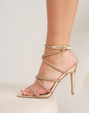 Gold sandals on a thin heel