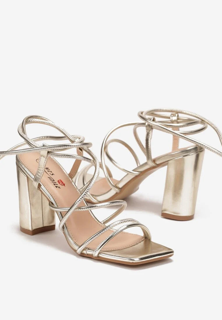 Gold sandals on a thin heel