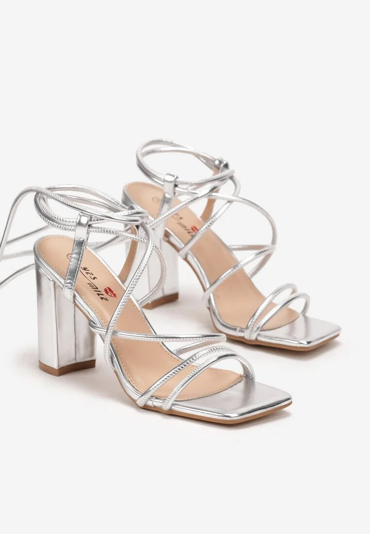 Silver sandals on a thin heel