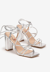 Silver sandals on a thin heel