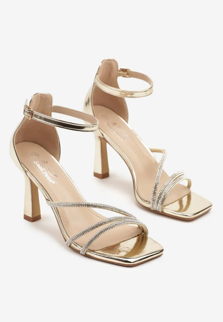 Gold sandals on a thin heel