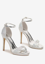 Silver sandals on a thin heel