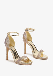 Gold sandals on a thin heel
