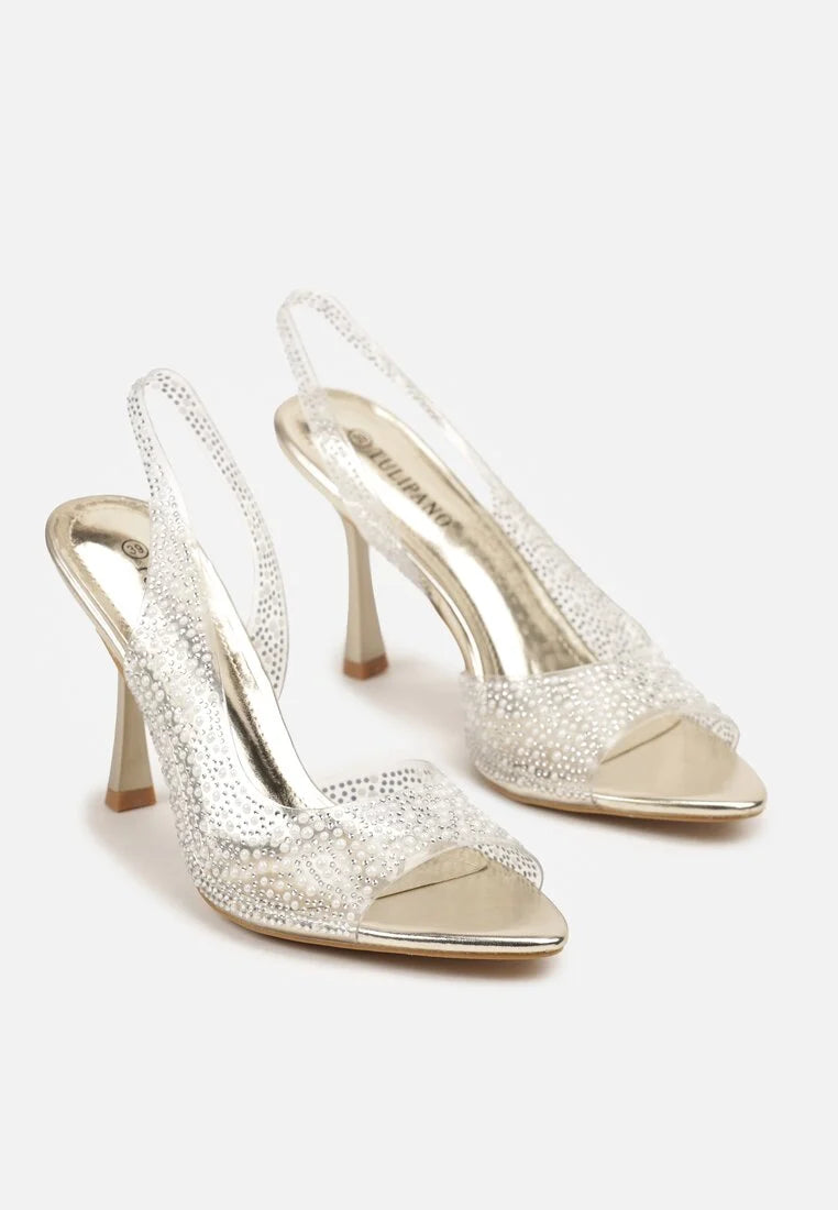 Gold sandals on a thin heel