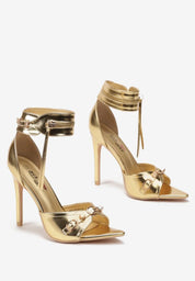 Gold sandals on a thin heel