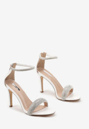 White sandals with a thin heel