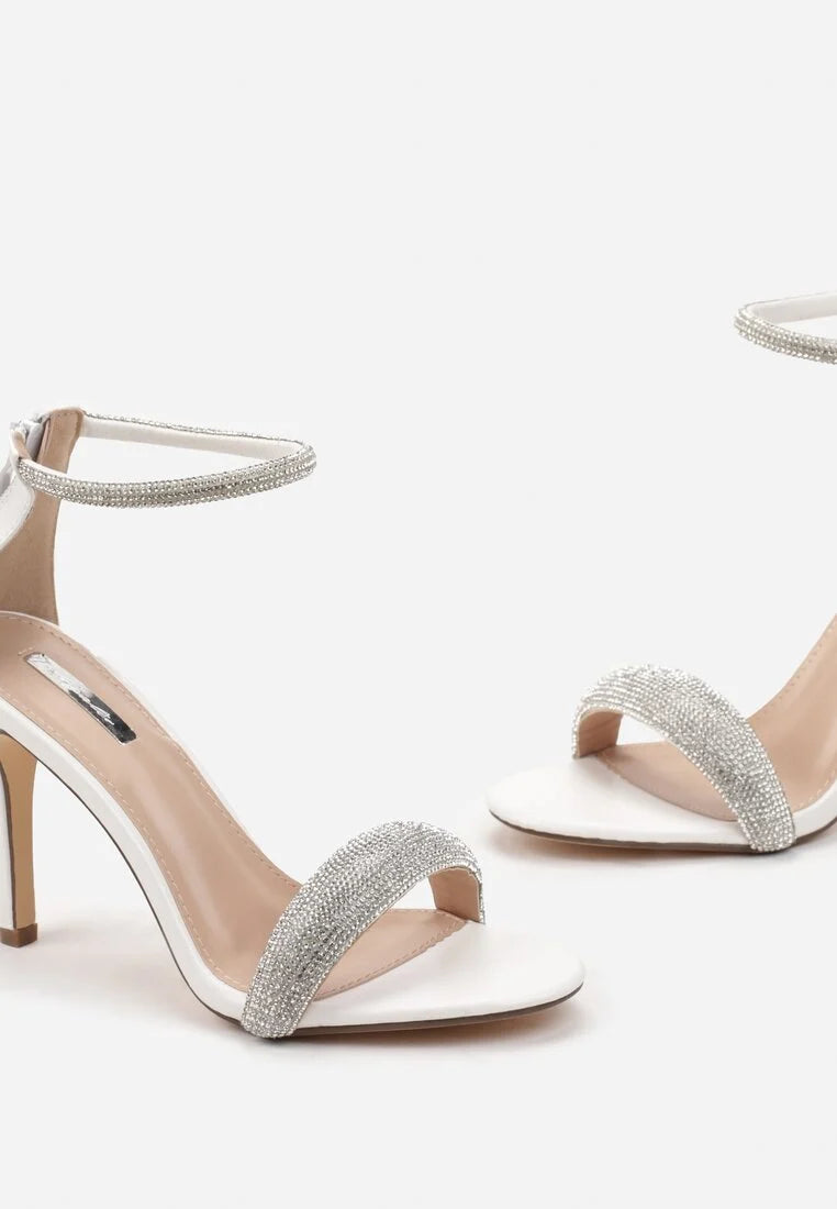 White sandals with a thin heel