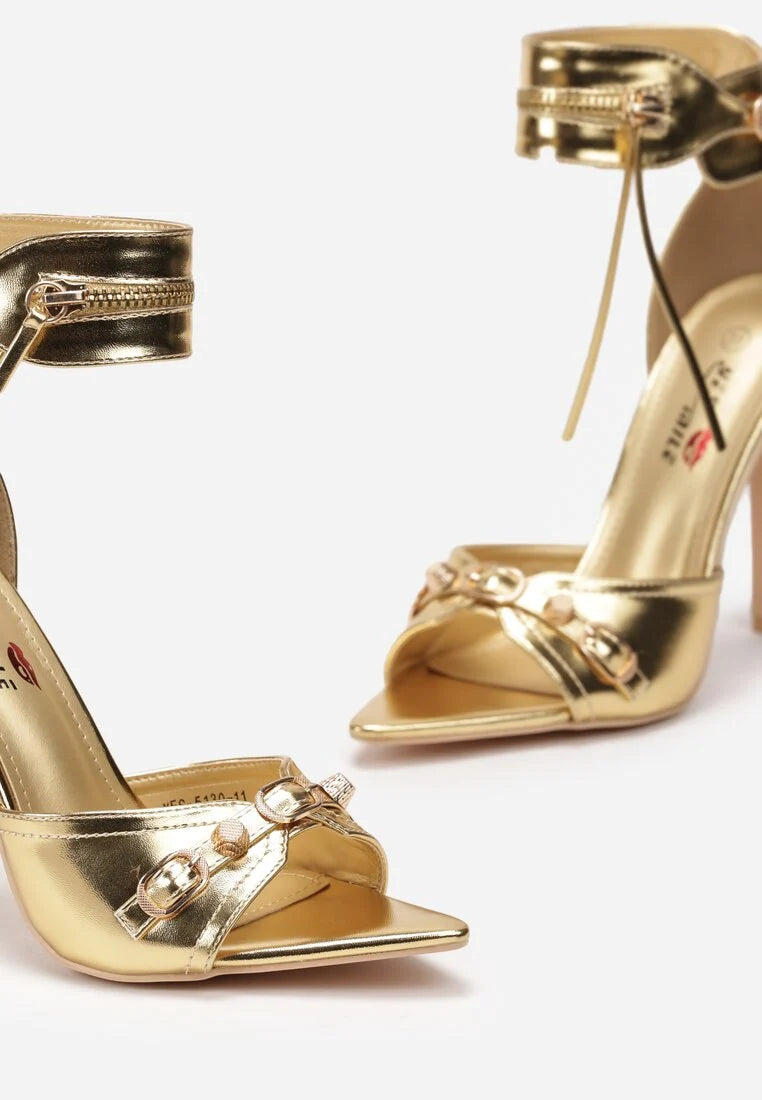 Gold sandals on a thin heel