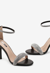 Black sandals with thin heels