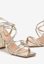 Gold sandals on a thin heel