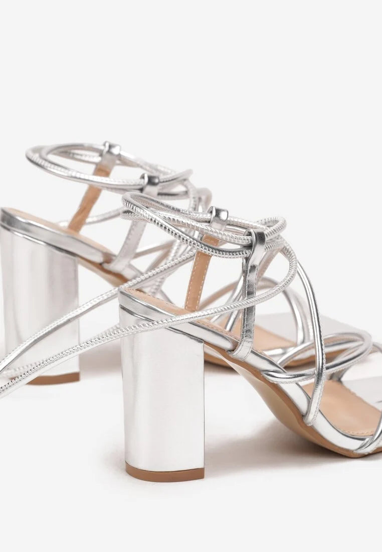 Silver sandals on a thin heel