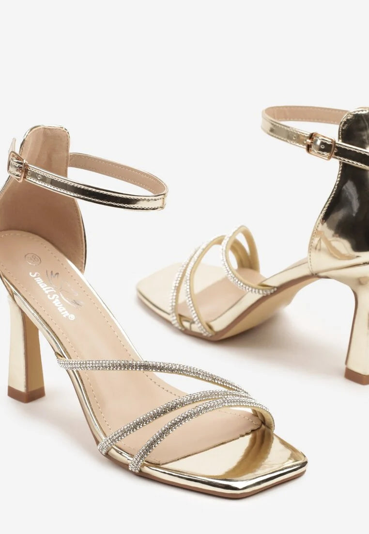 Gold sandals on a thin heel