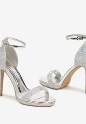 Silver sandals on a thin heel