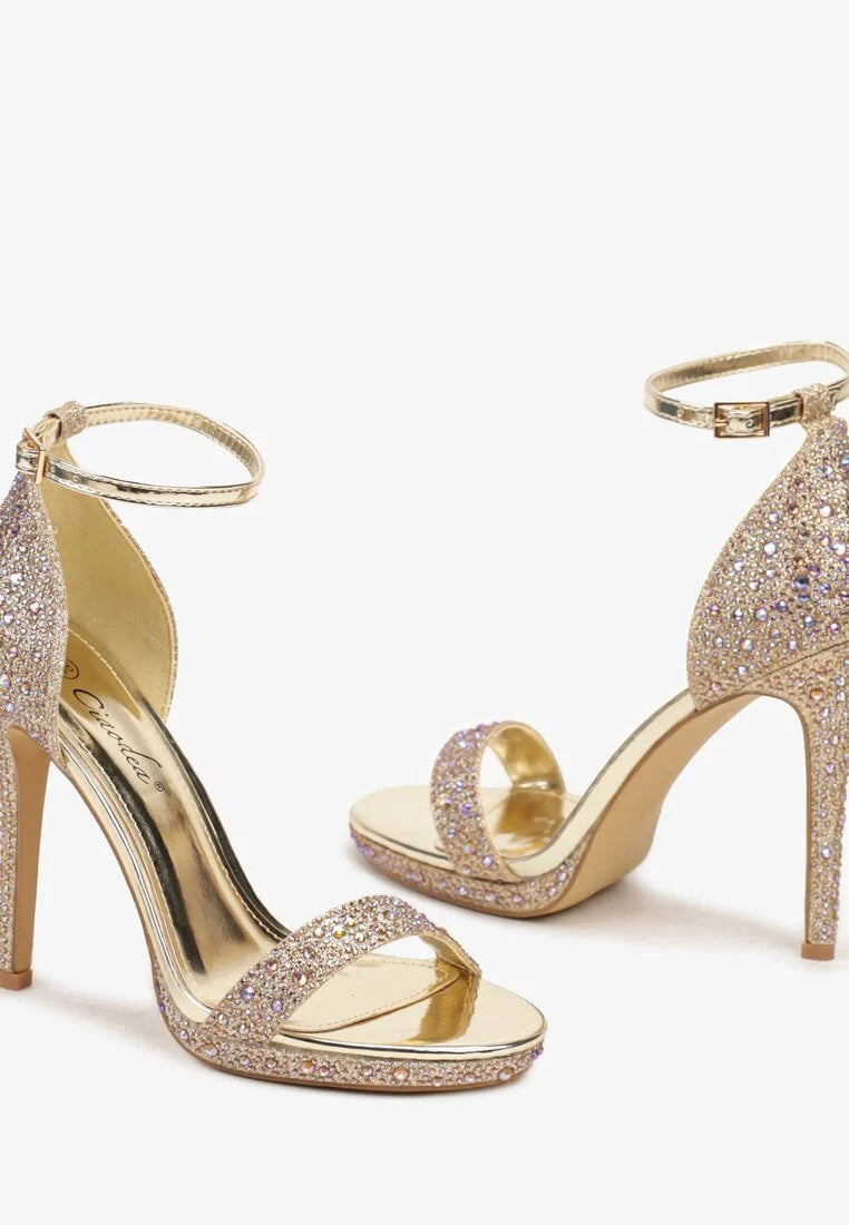 Gold sandals on a thin heel