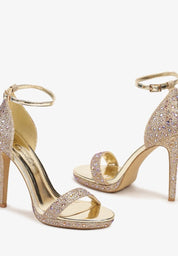 Gold sandals on a thin heel