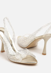 Gold sandals on a thin heel