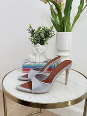 Silver sandals on a thin heel