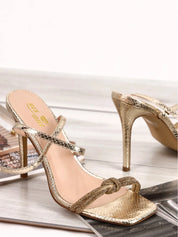 Gold sandals on a thin heel
