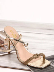 Gold sandals on a thin heel