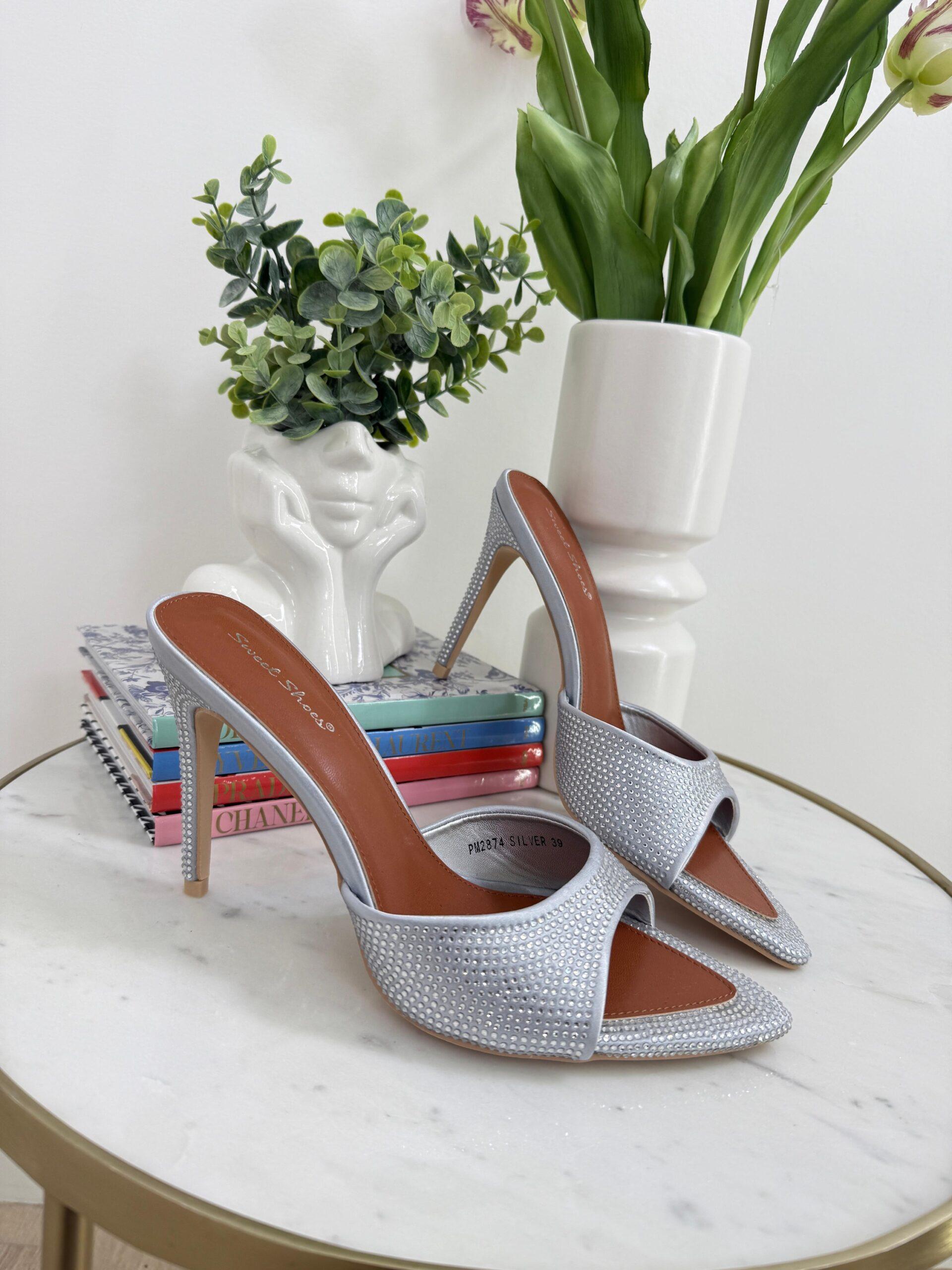 Silver sandals on a thin heel