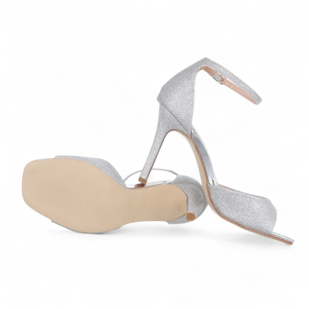 Silver sandals on a thin heel