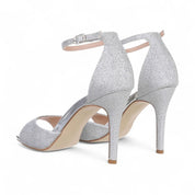 Silver sandals on a thin heel