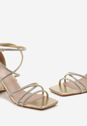 Goldene Sandalen mit Blockabsatz
