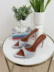 Silver sandals on a thin heel