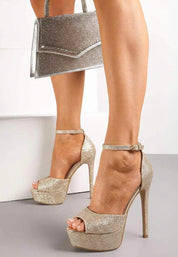 Silver high-heeled platform sandals with open toes