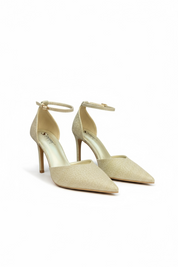 Gold heels on a thin heel