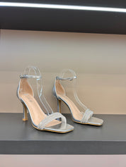 Black sandals with thin heels