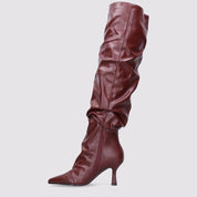 Burgundy high boots with a thin heel