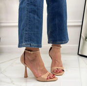 Beige sandals on a thin heel