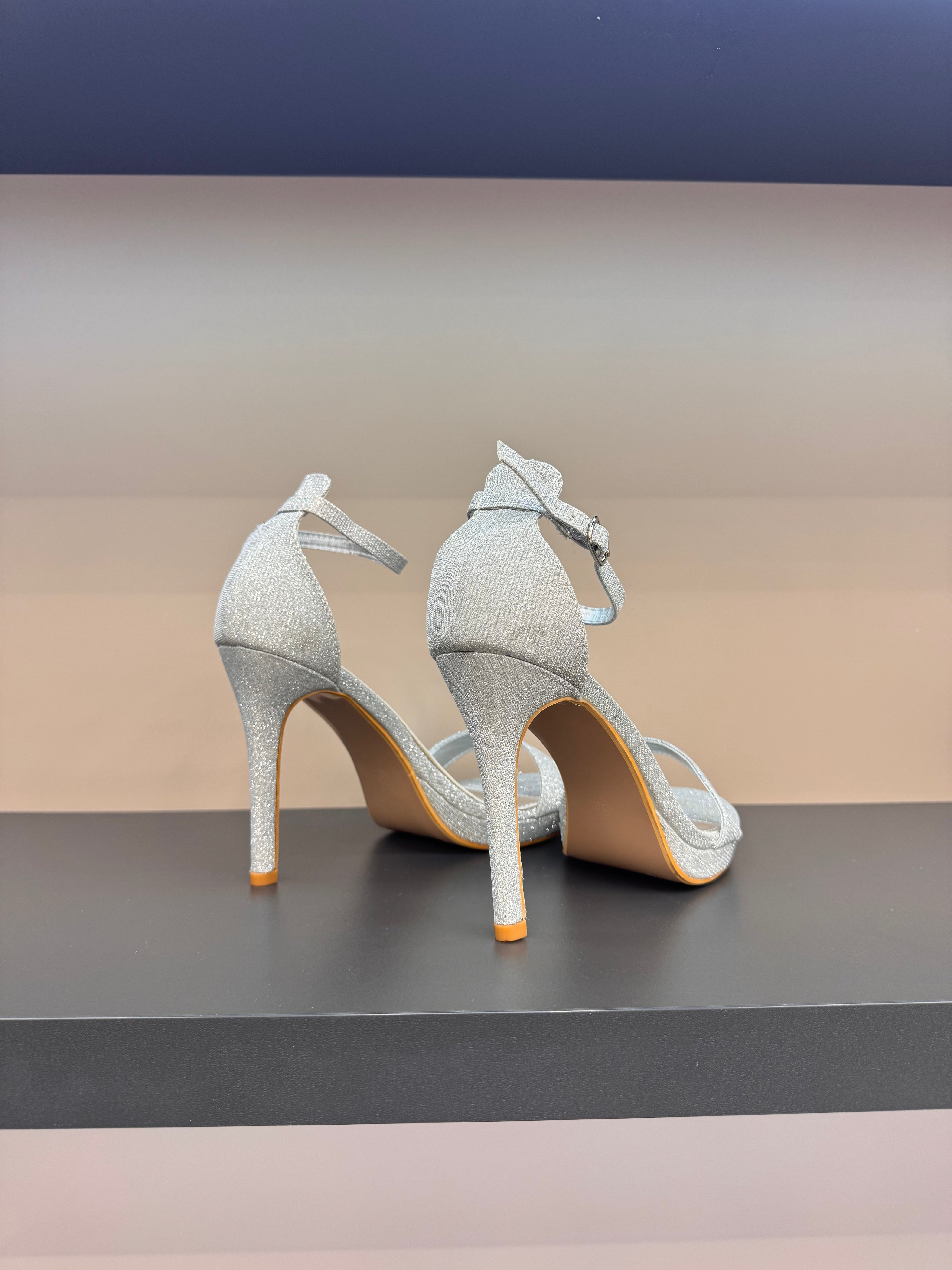 Gold sandals on a thin heel