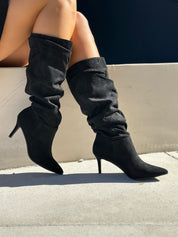 Black polished boots with a thin heel