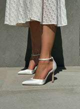 White stilettos with a thin heel