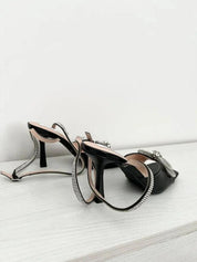 Black sandals with thin heels