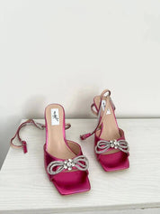 Fuchsia sandals with a thin heel