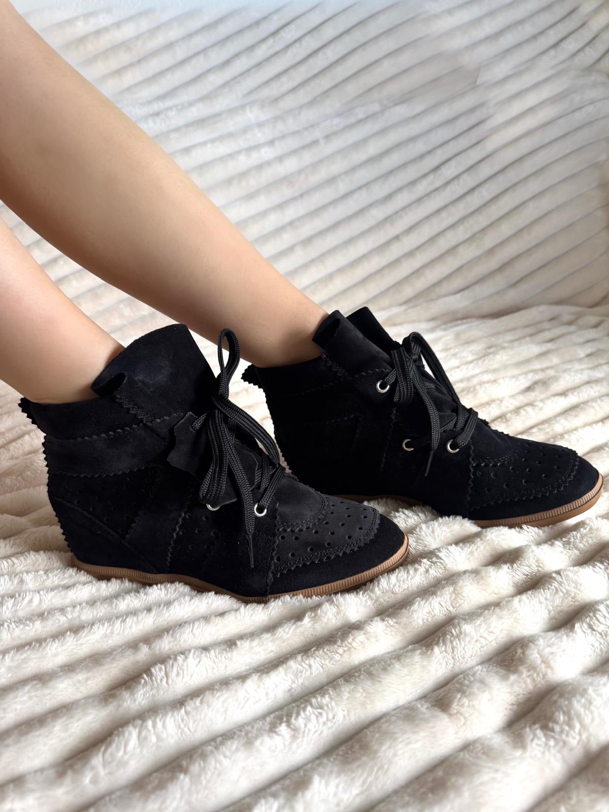 Black sneakers made of genuine leather