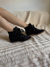 Black sneakers made of genuine leather