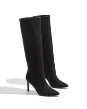 Black polished boots with a thin heel